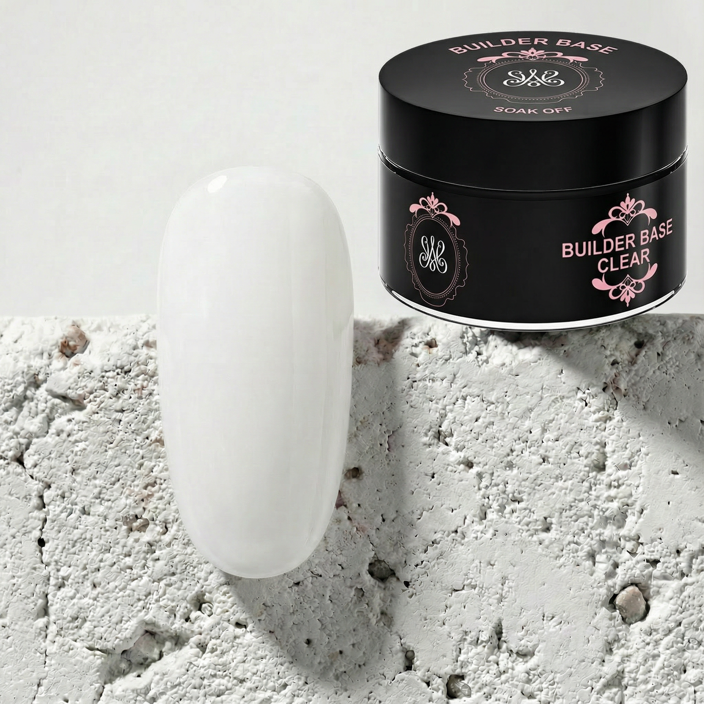 Studio Amelie Builder Base Clear – Transparentes Hybrid-Gel zur Naturnagelverstärkung, präsentiert neben einem glänzend klaren Musternagel